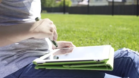 Side view of a girl with a tablet computer Stock Footage 79416984