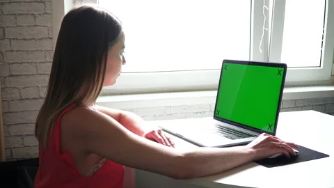 Side view of girl using laptop computer with green color key 스톡 동영상 164626683