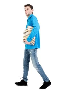 Side view of going  man carries a stack of books Stock Photos