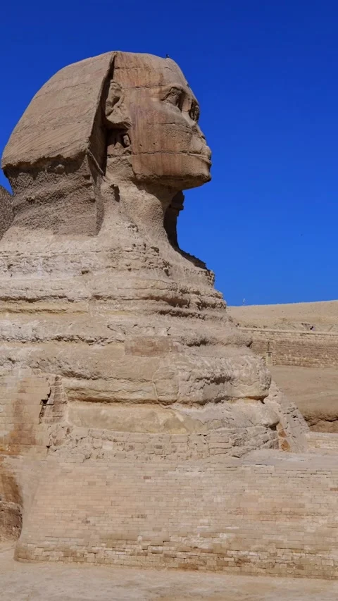 Side view of Great Sphinx with Pyramid of Khufu at Giza plateau, Egypt. Iconic Stock Footage 338185221