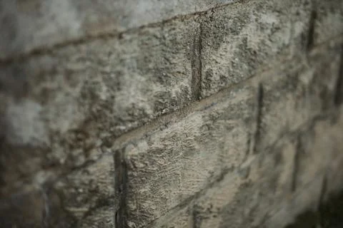 Side view of a grunge wall texture with rectangular tiles 스톡 사진
