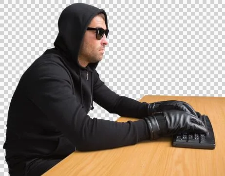 Side view of hacker using computer at desk 스톡 사진