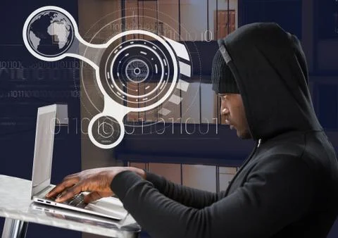 Side view of hacker using a laptop on a table in front of 3D digital background 写真素材
