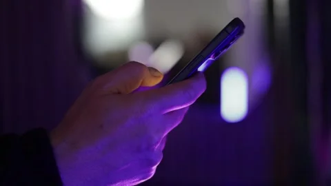 Side view of hand browsing content on mobile phone. Stock Footage 336811552