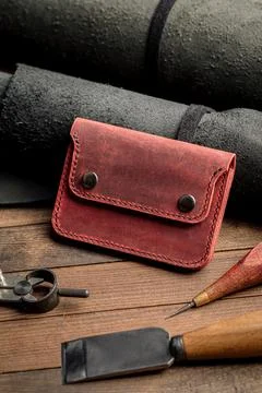 Side view on hand crafted red leather wallet Stock Photos