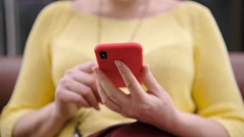 Side view. Hand of girl using smartphone in the shopping center, typing message Stock Footage 151364696