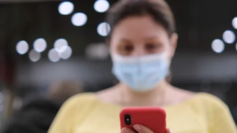 Side view. Hand of girl using smartphone in the shopping center Stock Footage 154074138