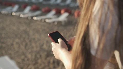 Side view. Hand of girl using smartphone on the terrace by the lake, typing Stock Footage 159541794