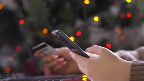 Side view. Hand of girl using smartphone in the living room at home, typing Stock Footage 164543907