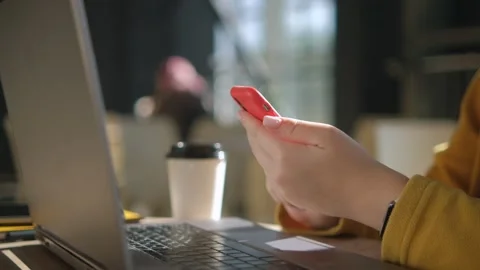 Side view. Hand of girl using texting mobile phone or chat in cafe morning and Stock Footage 254593005