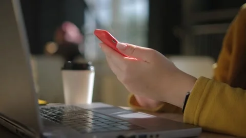 Side view. Hand of girl using texting mobile phone or chat in cafe morning and Stock Footage 254698096