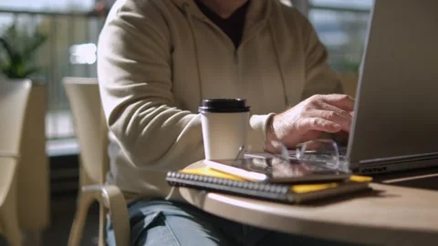Side view. Hand of man using texting mobile phone or chat in cafe morning and Stock Footage 252706061
