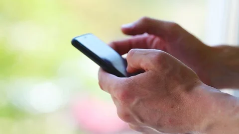 Side view. Hand of men using smartphone . Stock Footage 129845003