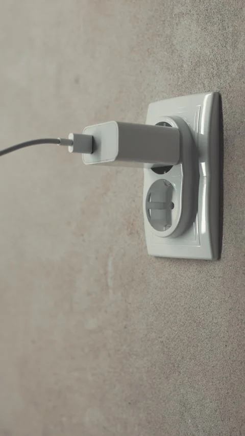 Side View Hand Plugging Cable Into Socket Stock Footage 347251671