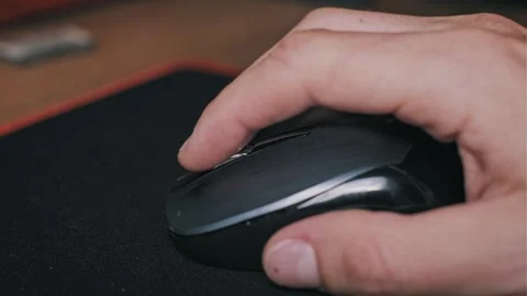 Side View of Hand Scrolling Mouse on Wooden Table Video stock 330297705