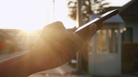 Side view. Hand of woman using smartphone on road Stock Footage 120729606