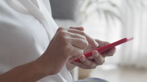 Side view. Hand of woman using a smartphone. Close-up of young women hand Stock Footage 137625014