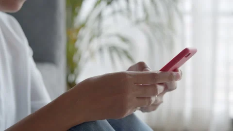 Side view. Hand of woman using smartphone at home. Close-up of young women hand Stock Footage 137710986