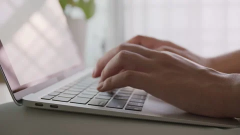 Side view. Hand of woman using a laptop, business typing work with computer Stock Footage 164203050