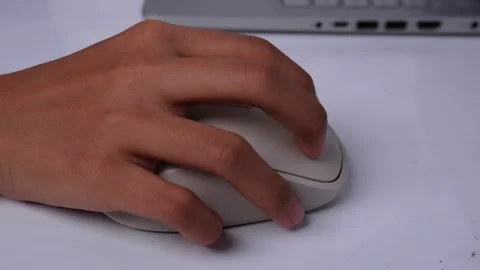 Side view of hand working with mouse on white table Stock Footage 270509297