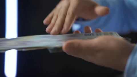 Side view of hands counting Romanian 100 leu bills Stock Footage 315051021