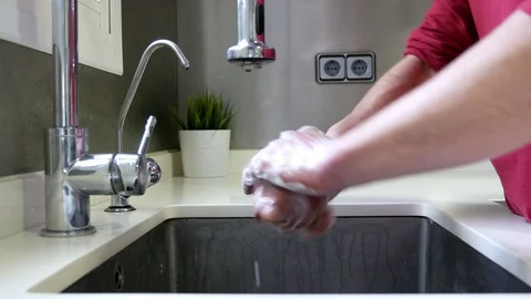 Side view of a hands in a sink washing with soap. Stock Footage