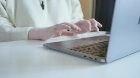 Side view on hands texting rapidly mail or chatting with friends on keyboard Stock Footage 101259162