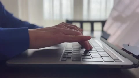 Side view of hands typing on laptop — modern office and technology Stock-Footage 319655592