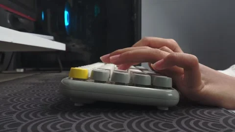 Side view of hands typing on wireless keyboard Stock Footage 276586581