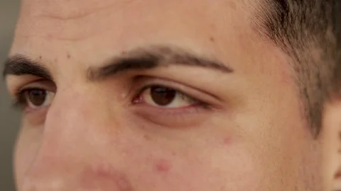 Side view of handsome young man with brown eyes looking aside Stock Footage 102953929