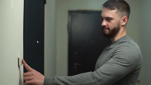 Side view of handsome young man comes to visit his friends or girlfriend or home Stock Footage 146637327