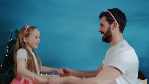 Side view happy handsome father and his daughter playing fairies dancing Stock-Footage 112269630