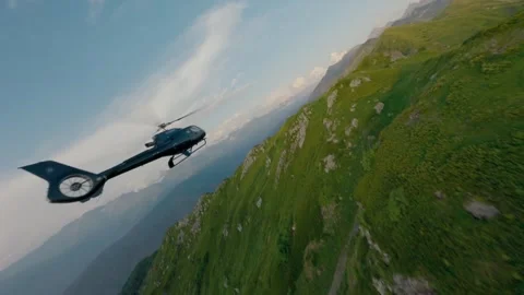 Side view helicopter at sunset mountain valley ridge aerial view Stock Footage 330076487