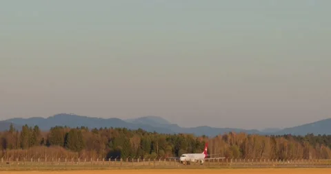 Side view of Helvetic Airways passenger airplane accelerates on the runway Stock Footage 210230202
