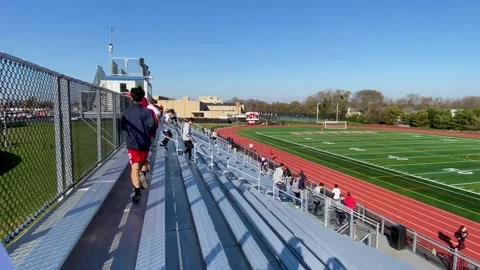 Side view of a high school track team Stock Video Pond5
