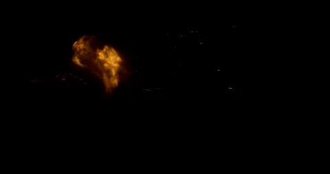 Side view high-speed explosions isolated on black background Stock Footage 327902845