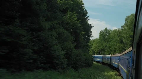 Side view of high-speed turning train on landscape of beautiful nature wild Video stock 159370467