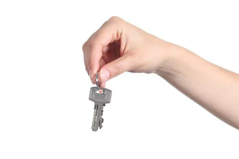 Side view of home keys hanging from a woman hand Stock Photos