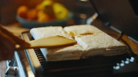 Side view of a homemade shawarma lying on an electric grill. Stock Footage 238436597
