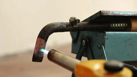 Side view of hot professional soldering iron on workplace stand Stock Footage 339298348