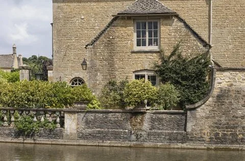 Side view of a house next to a river Stock Photos