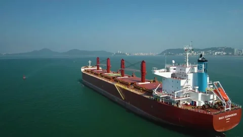 Side view of huge bulk carrier ship or vessel in the ocean aerial footage Stock Footage 225868827