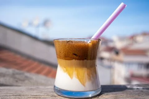 Side view of iced dalgona coffee on wood at the rooftop, Korean coffee Stock Photos