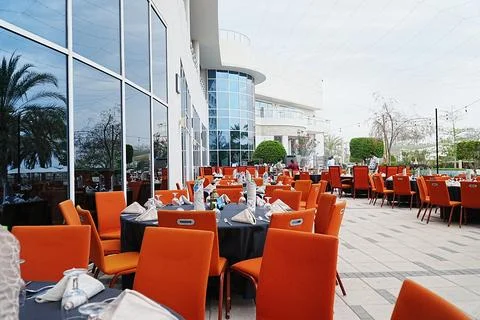 Side view of iftar setting with tables set in the row in five star hotel, Muscat Stock Photos
