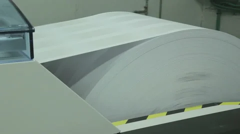 Side view on industrial paper roll feed into printer Video stock 63512377