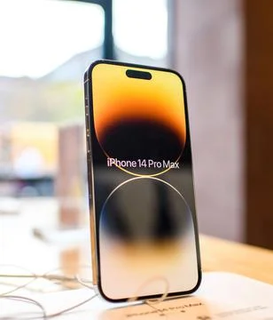 Side view of iPhone 14 Pro Max new smartphone by Apple Computers on the wooden Stock Photos