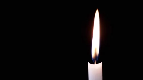 Side view, Isolated Burning Candle with Bright Flame on Dark Background Stock Footage 312013111