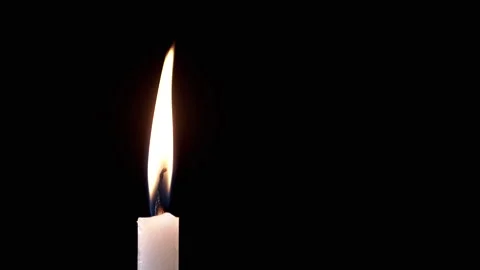 Side view, Isolated Burning Candle with Bright Flame on Dark Background Stock Footage 312013153