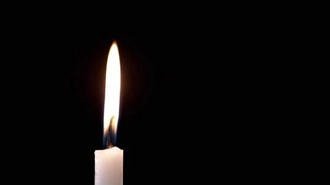 Side view, Isolated Burning Candle with Bright Flame on Dark Background Stock Footage 312013303