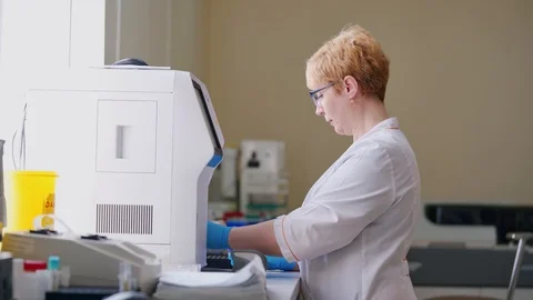 Side view of a laboratory worker. Modern... | Stock Video | Pond5